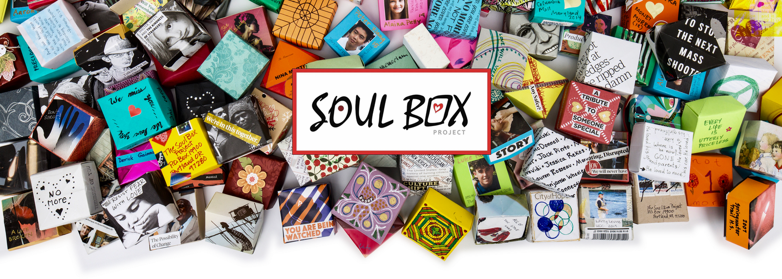 Homepage header image of origami folded boxes falling down with Soul Box Logo in the middle