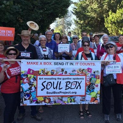 Soul Box banner held by people marching