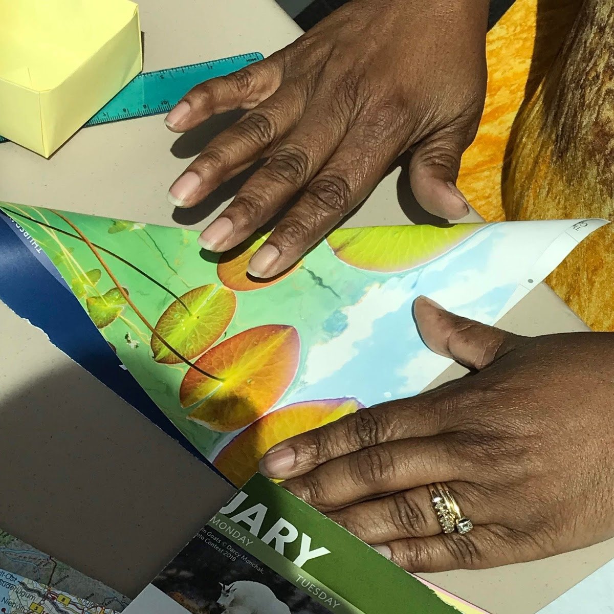 Hands fold paper to make a Soul Box