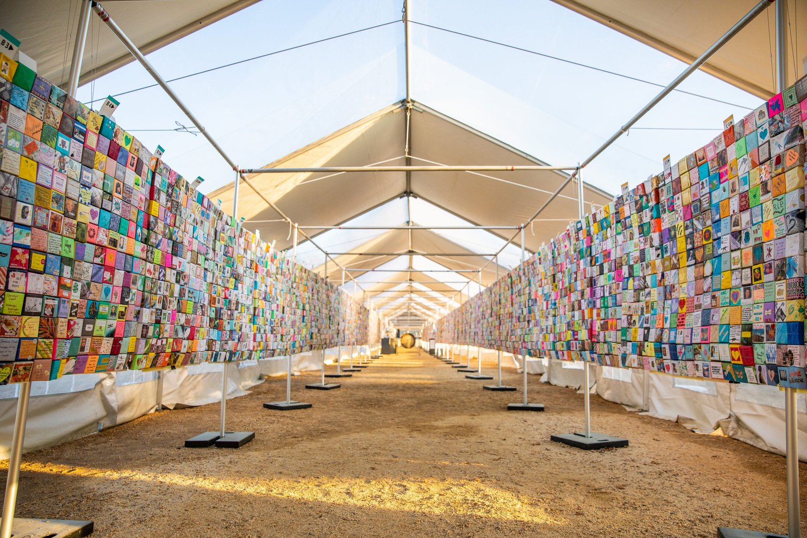 Pathway between 200-foot-long walls of Soul Box Panels under a canopy